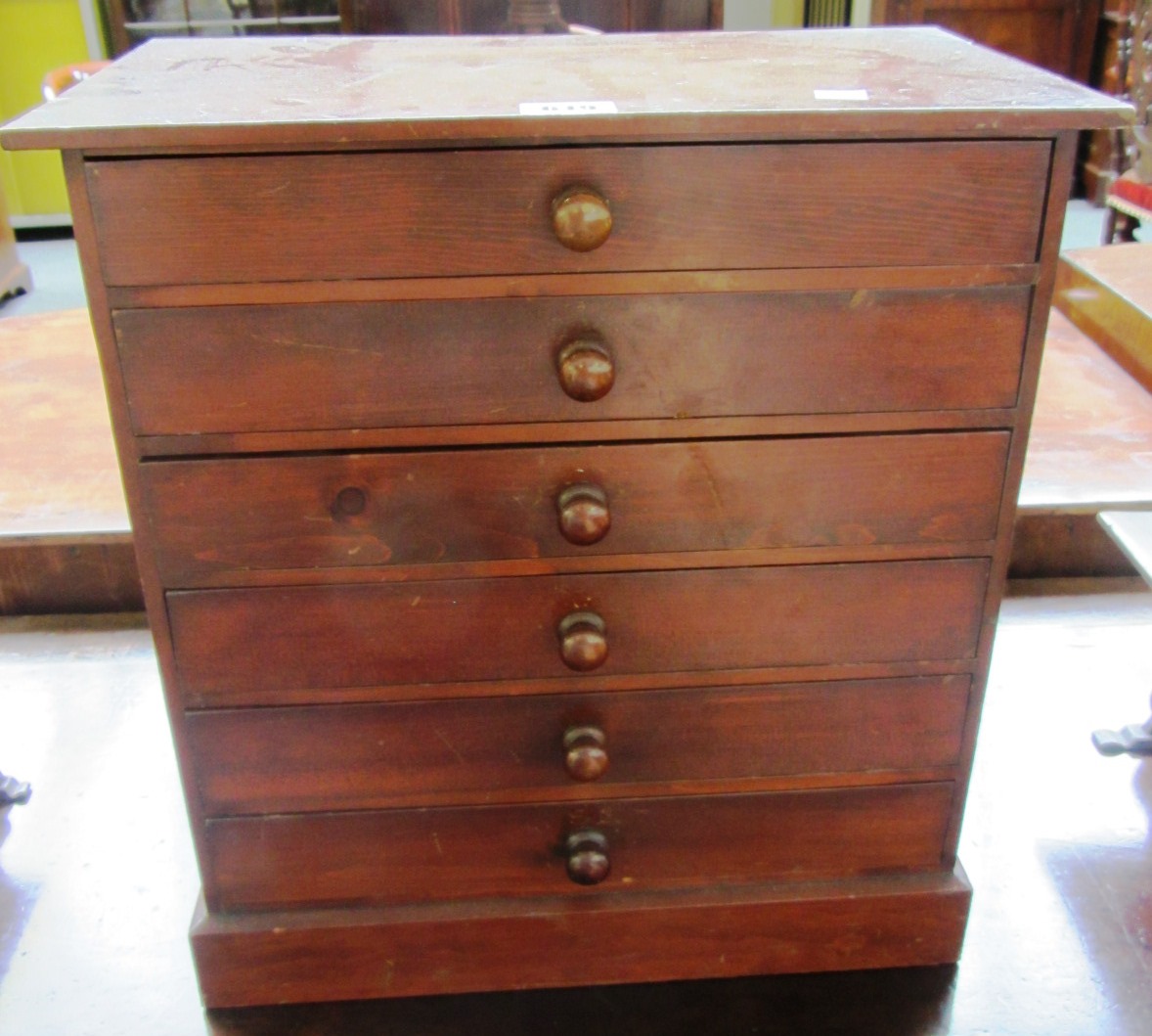 Appraisal: A pine table top collectors cabinet of six long graduated