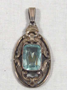 Appraisal: A continental silver and blue topaz pendant marked the maker's