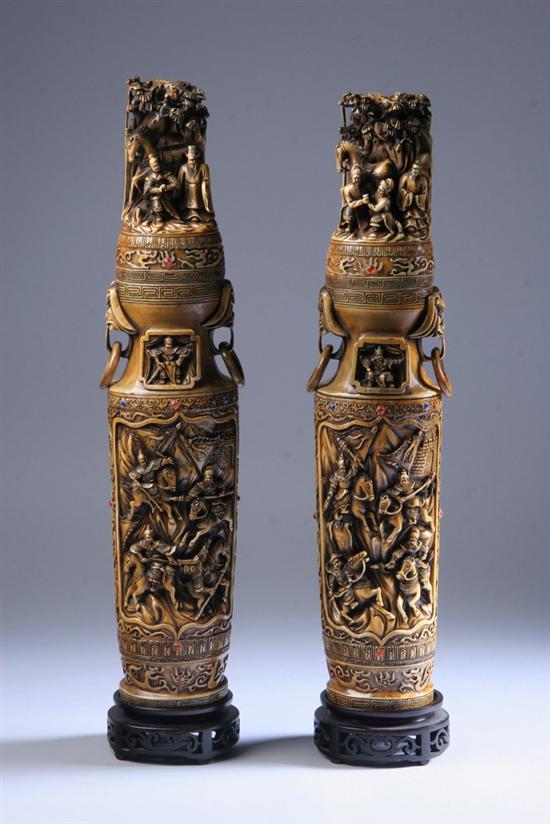 Appraisal: PAIR CHINESE IVORY VASES AND COVERS Each carved to depict