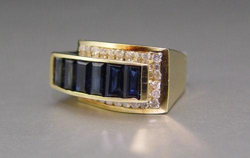 Appraisal: OH SO DRAMATIC SAPPHIRE AND DIAMOND RING K yellow gold