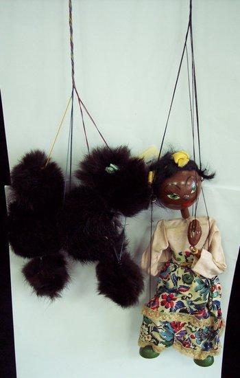 Appraisal: Two Pelham puppets black poodle and African girl with a