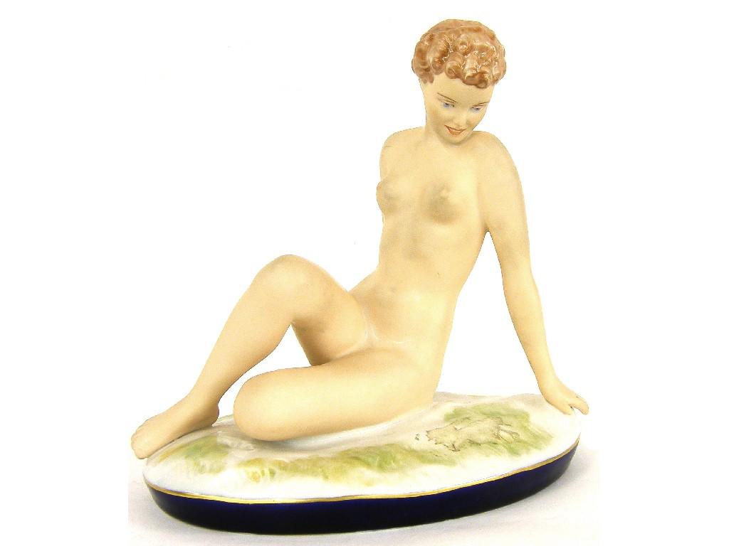 Appraisal: Royal Dux porcelain figure of a reclining female nude by