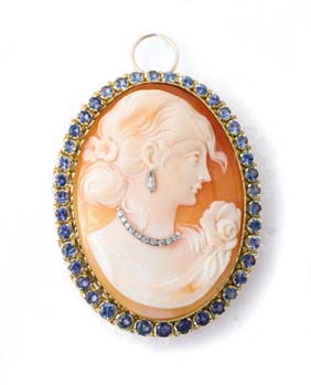 Appraisal: CAMEO WITH SAPPHIRES AND DIAMONDS Shell cameo brooch with sapphire-set