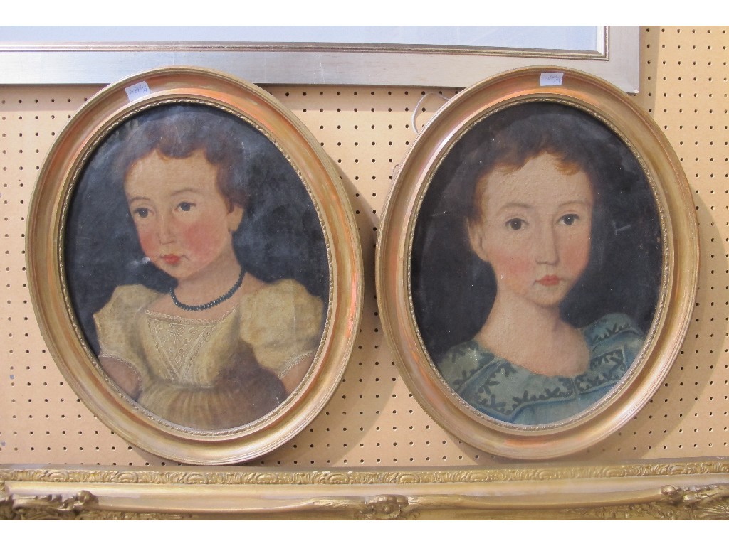 Appraisal: Pair of oval oil on canvas portraits of children