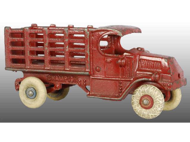 Appraisal: Cast Iron Champion Mack Red Stake Truck Toy Description Red