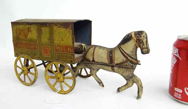 Appraisal: Early ''Oakdale Farm Milk'' tin litho horse and wagon toy