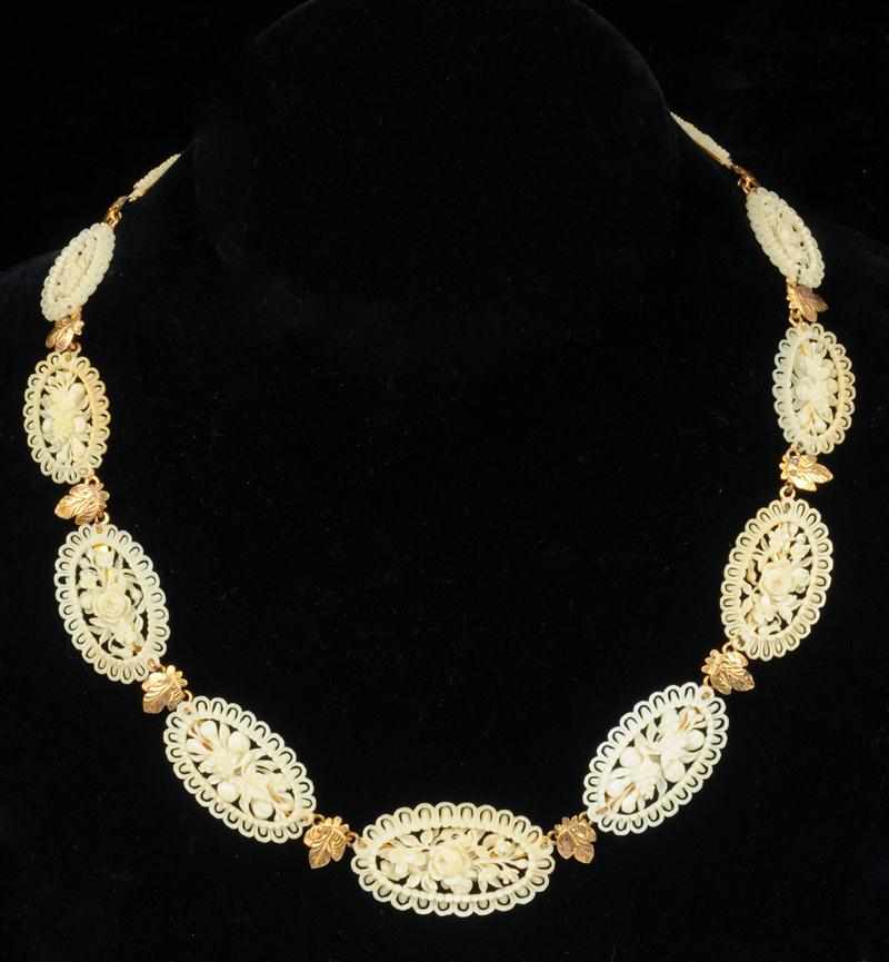 Appraisal: ANTIQUE GOLD AND CARVED IVORY NECKLACE in The Estate of