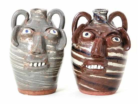 Appraisal: B B Craig stoneware swirl face jugs North Carolina alkaline