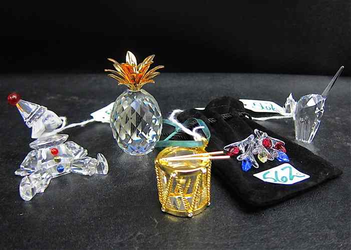 Appraisal: FIVE SWAROVSKI CRYSTALS Pineapple small Puppet Tomcat drum ornament and