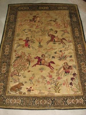 Appraisal: A PERSIAN PICTORIAL RUG the ivory field depicting mounted hunters