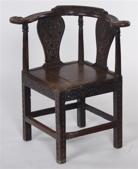 Appraisal: A George III later carved corner chair the stepped top-rail