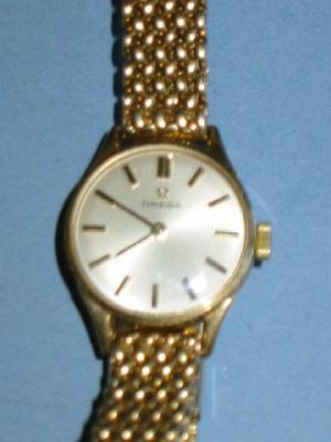 Appraisal: A LADY'S OMEGA WRIST WATCH with circular silvered face and