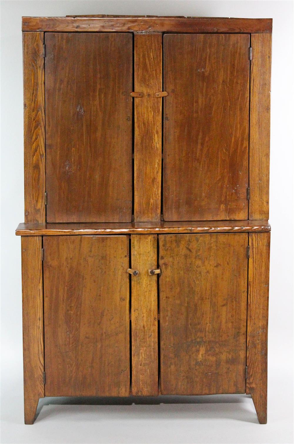 Appraisal: AMERICAN COUNTRY STAINED PINE CUPBOARD in one piece having a