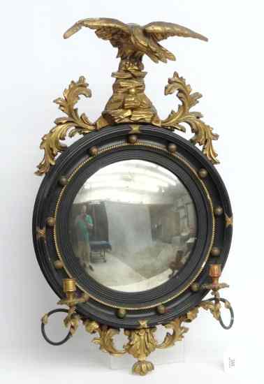 Appraisal: Early bullseye mirror having carved eagle crest and candleholders ''