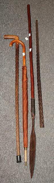 Appraisal: Assegai speartogether with two umbrellas and two walking sticks with