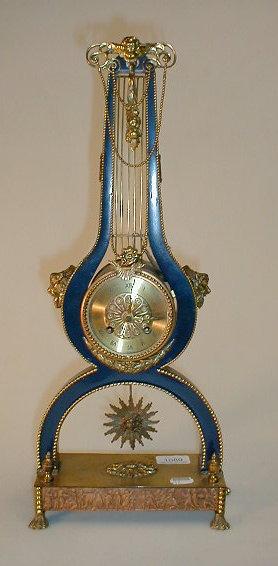 Appraisal: A French gilt metal copper and blue enamelled lyre clock