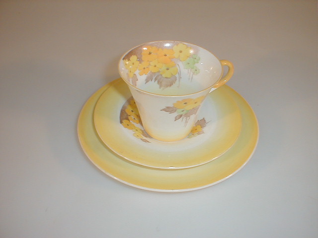 Appraisal: A Shelley china Perth Phlox trio painted with yellow flowers