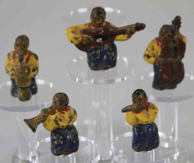 Appraisal: HUBLEY FIVE PIECE MUSICIAN PAPERWEIGHTS Black American grouping of five