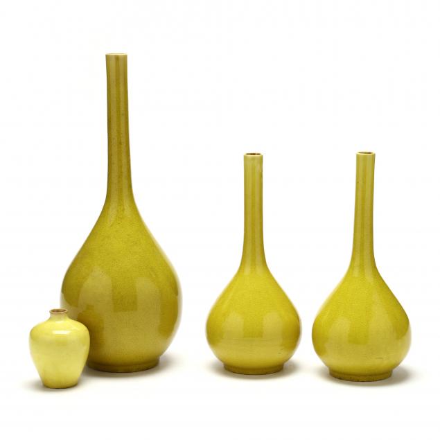 Appraisal: FOUR CHINESE MONOCHROME YELLOW VASES th century porcelain with egg