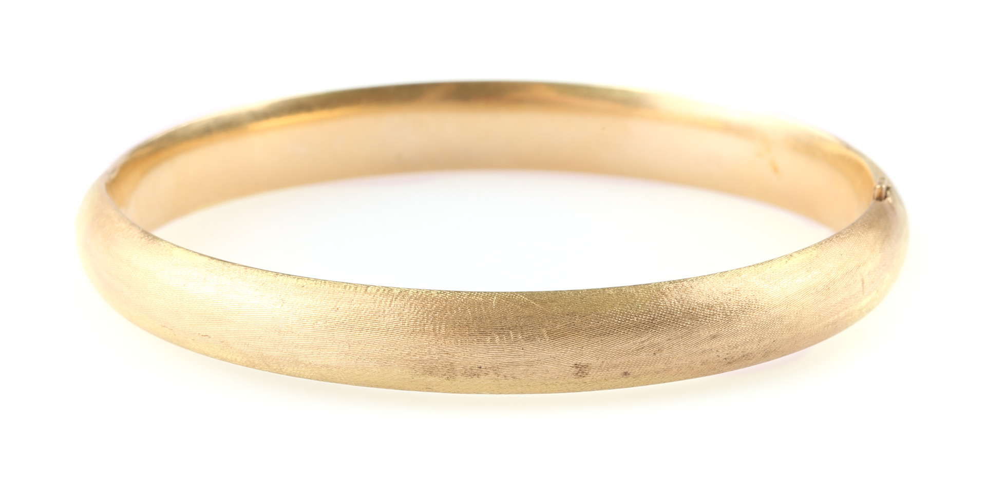 Appraisal: A Satin Gold Bangle Bracelet K brushed gold bangle with