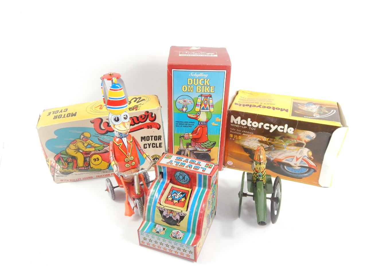 Appraisal: Various tin plate toys to include a duck on bike