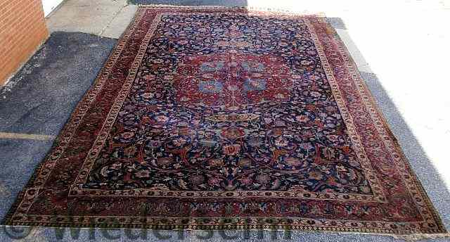 Appraisal: Palace size Persian oriental carpet with a blue field and