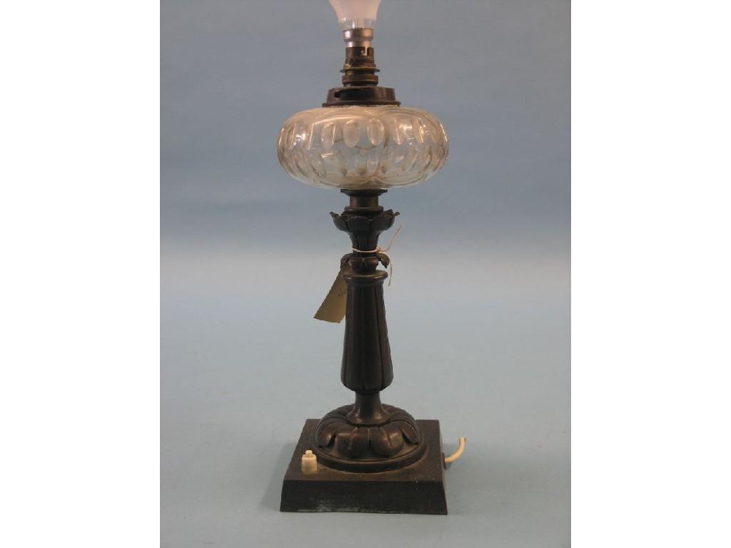 Appraisal: A late th century patinated bronze table lamp columnar form