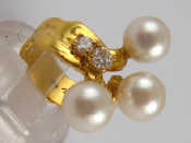 Appraisal: A French hallmarked carat gold diamond and cultured pearl ring