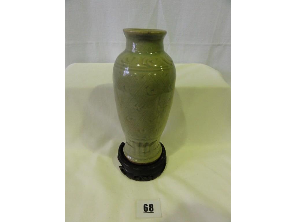 Appraisal: A th century Chinese celadon glazed vase with simple incised