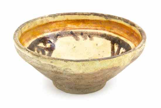 Appraisal: A Middle Eastern Pottery Bowl with an orange band to