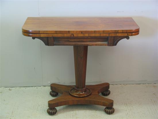 Appraisal: th Century rosewood folding card table on square column support