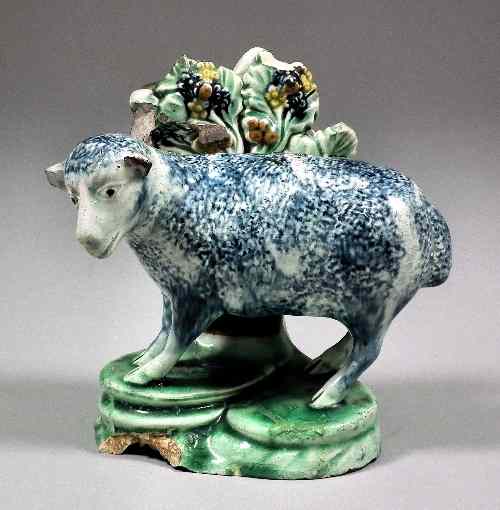 Appraisal: An unusual early Staffordshire pottery figure of a standing sheep