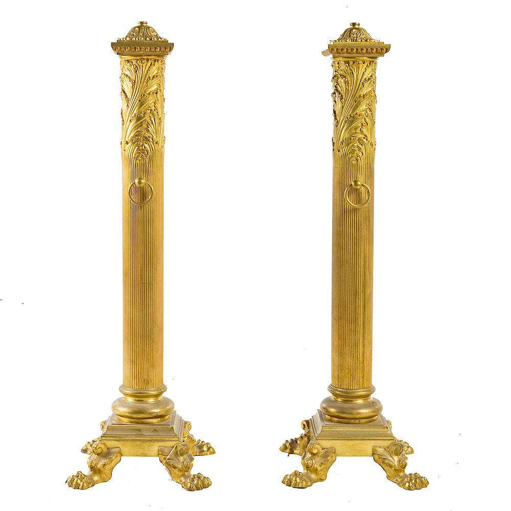 Appraisal: Pair Classical style brass andirons early th century foliate caps