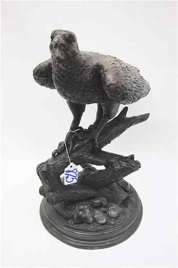 Appraisal: BRONZE WILDLIFE SCULPTURE of an eagle on a tree limb