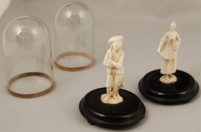 Appraisal: Two th century French carved ivory figures of a lady