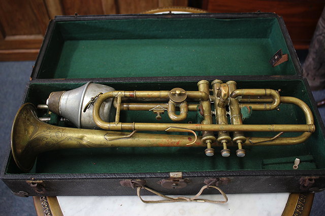 Appraisal: AN OLD BRASS TRUMPET with an engraved horn