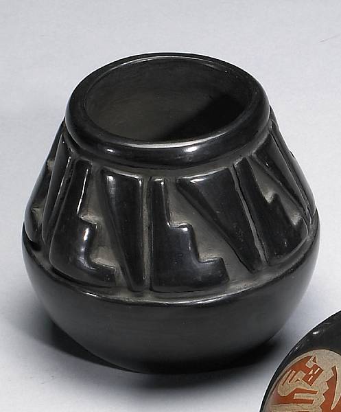 Appraisal: A Santa Clara carved blackware jar Margaret Tafoya carved with