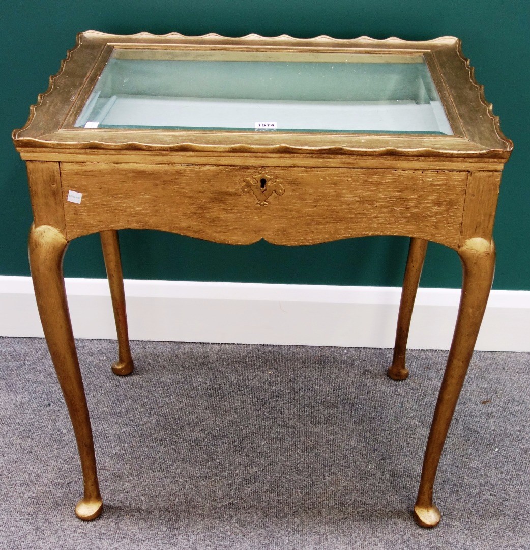 Appraisal: A late th century gold painted rectangular bijouterie table on