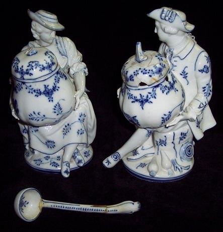 Appraisal: A pair of Berlin blue and white figurative mustard pots