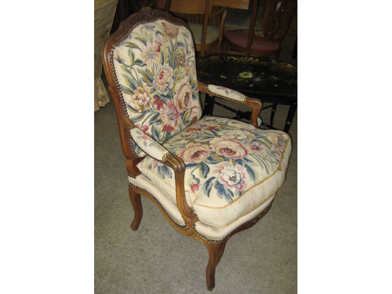 Appraisal: FRENCH LOUIS XV STYLE FAUTEUIL Centering a floral carved crest