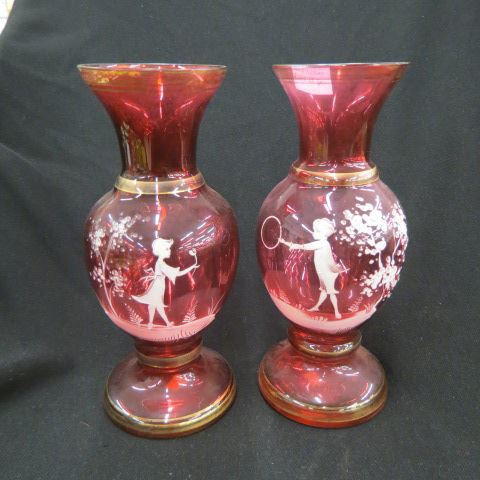 Appraisal: Pair of Mary Gregory Style Cranberry Art GlassVases boy with