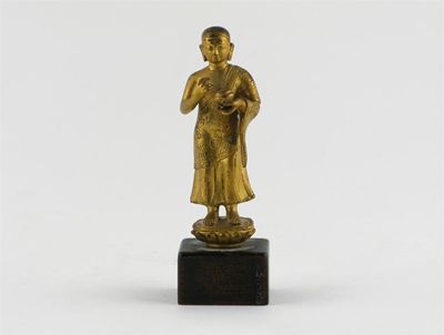 Appraisal: A small Chinese gilt bronze figure of a monk standing