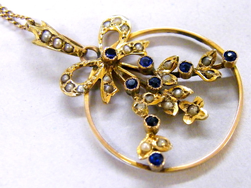 Appraisal: Attractive circular gold seed pearl and blue stone pendant on