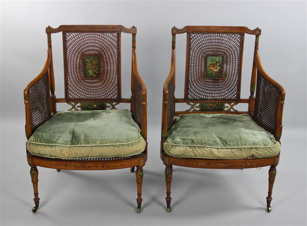 Appraisal: PAIR OF EDWARDIAN PAINT DECORATED CANED ARM CHAIRS in the