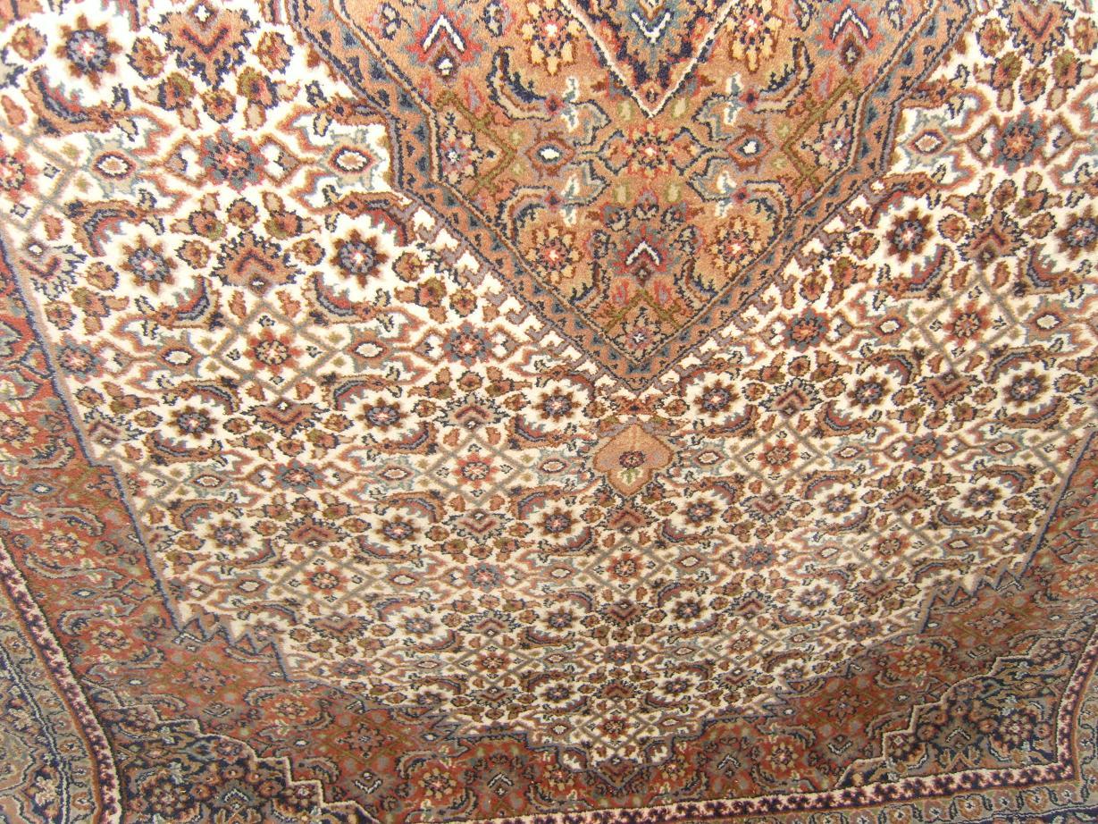 Appraisal: A white ground Eastern wool carpet with all over floral