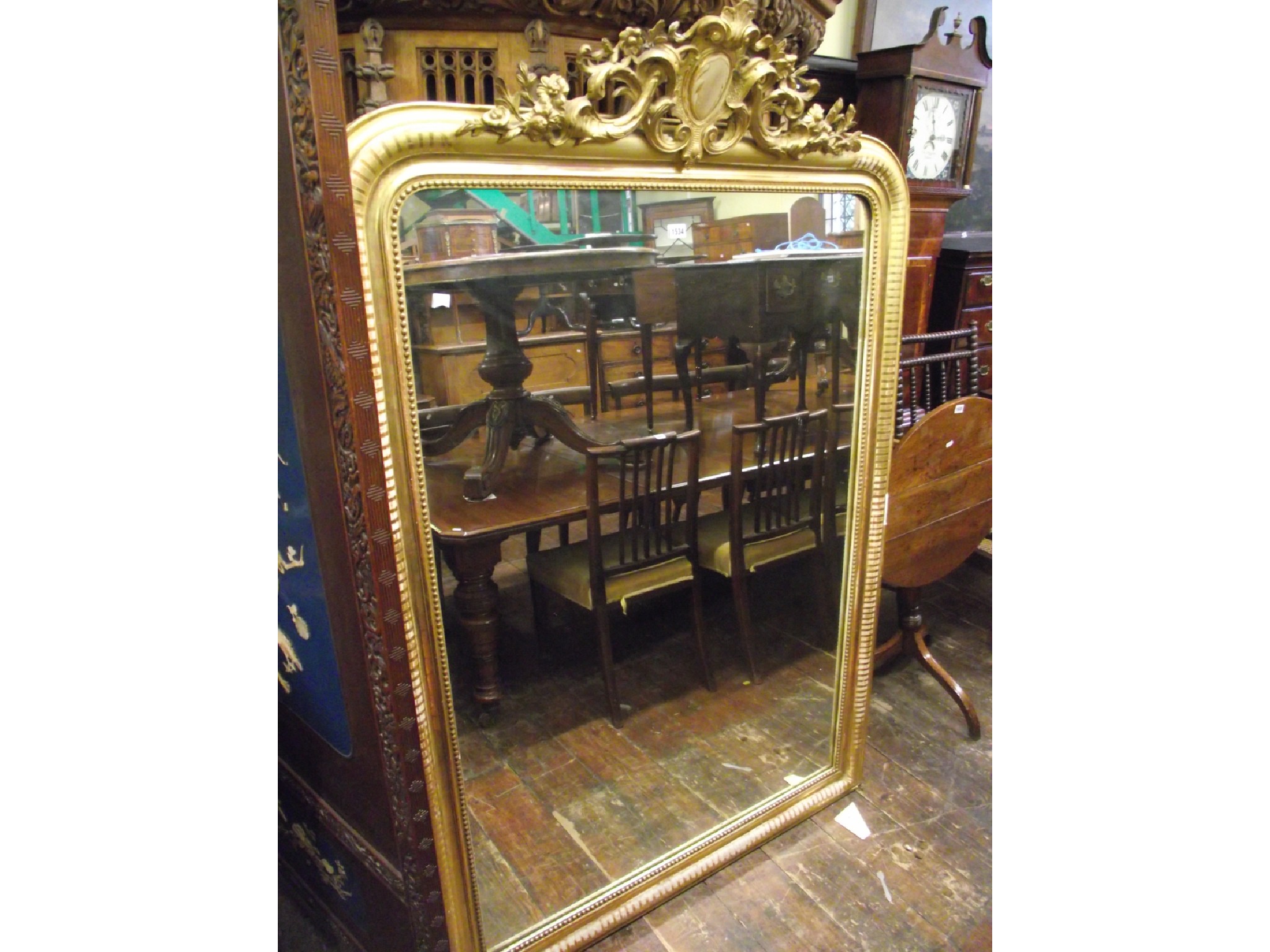 Appraisal: A substantial th century overmantle mirror with original gilded finish