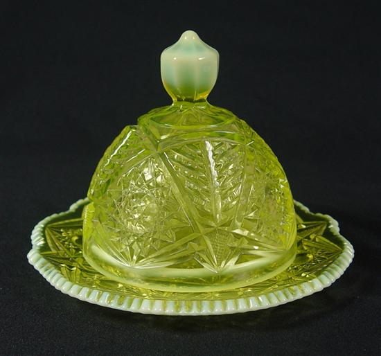 Appraisal: Vaseline Glass Butter Dish Circa Starburst pattern with opalescent edging