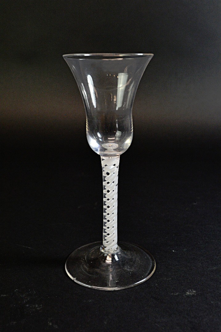 Appraisal: An opaque twist wine glass circa the bell bowl raised