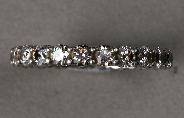 Appraisal: A DIAMOND SET FULL ETERNITY RING with claw set brilliant