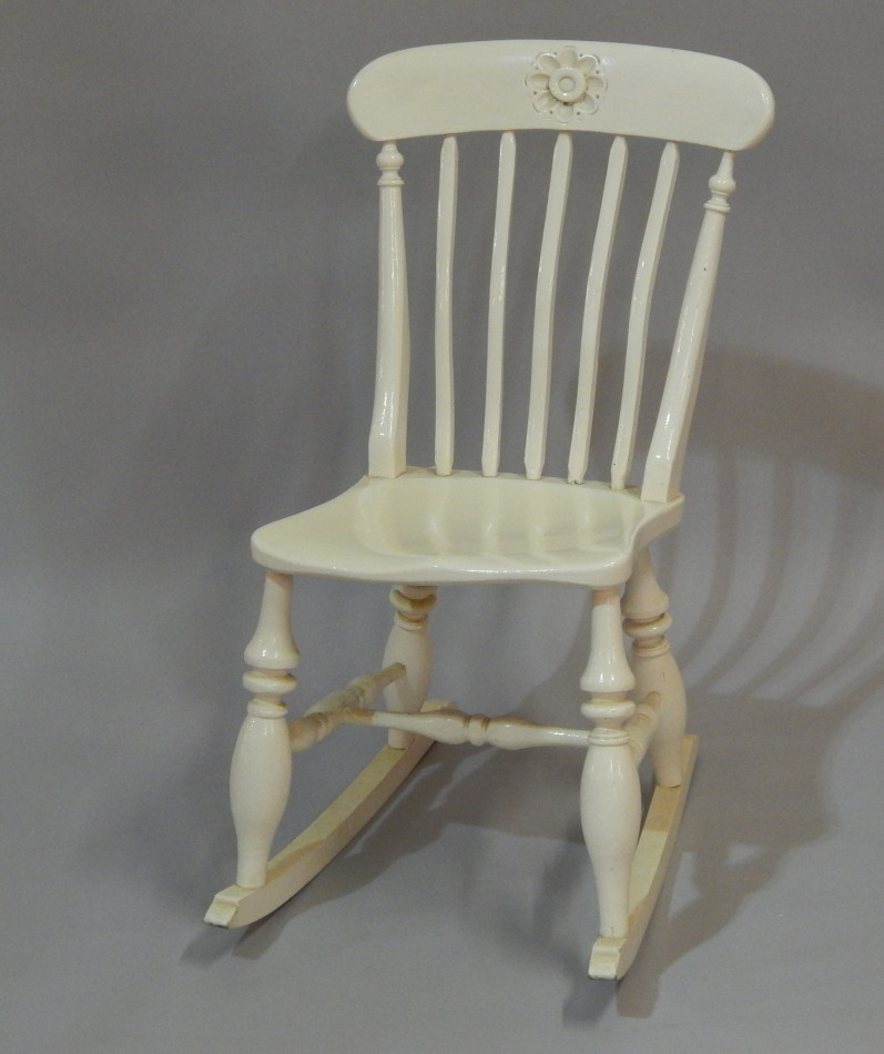 Appraisal: A Victorian painted rocking chair with a slat back on